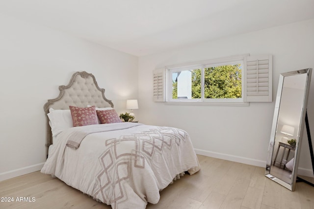 bedroom with light hardwood / wood-style floors