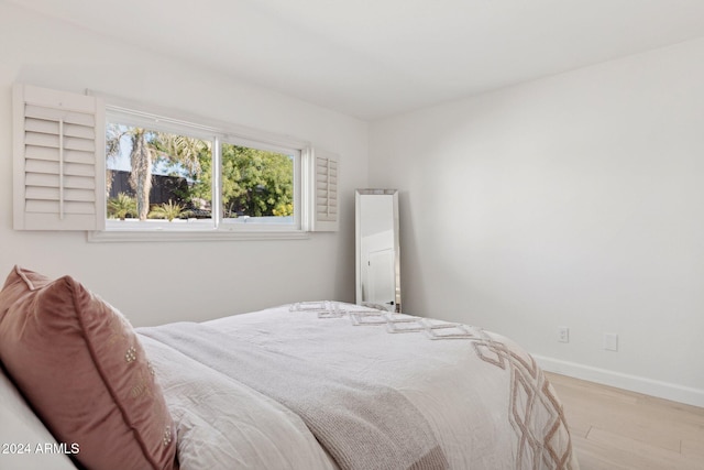 bedroom with light wood-type flooring