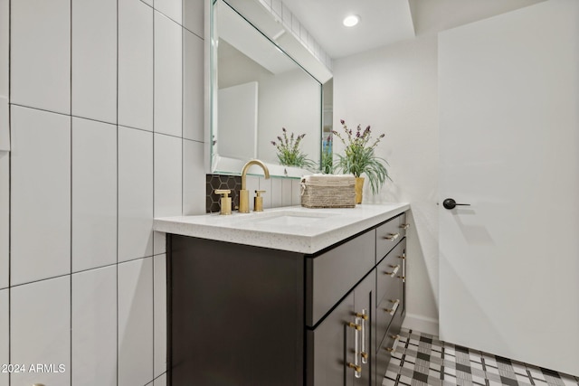 bathroom featuring decorative backsplash and vanity