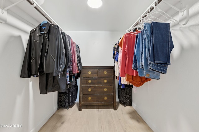 spacious closet with light hardwood / wood-style flooring