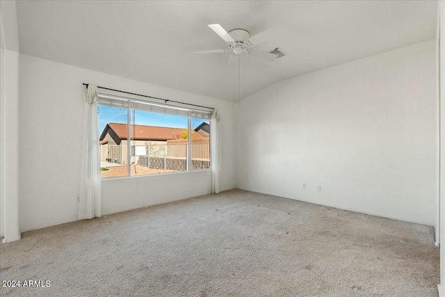 carpeted spare room with ceiling fan