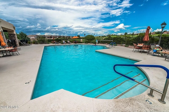 view of pool featuring a patio area