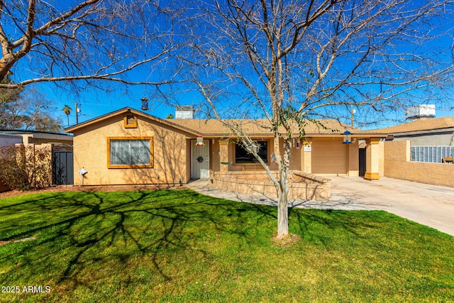 ranch-style home featuring an attached garage, driveway, a front yard, and stucco siding