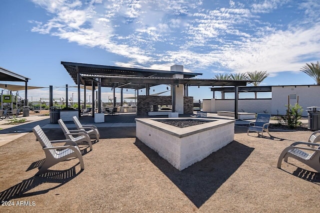 view of patio / terrace featuring an outdoor fire pit