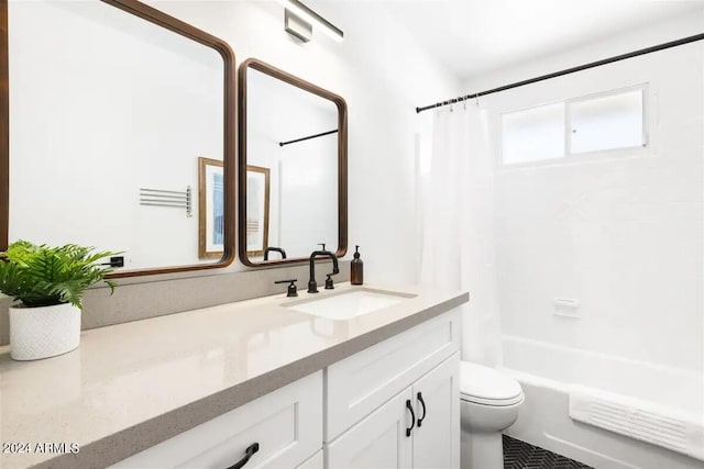 full bathroom featuring shower / bathtub combination with curtain, vanity, and toilet