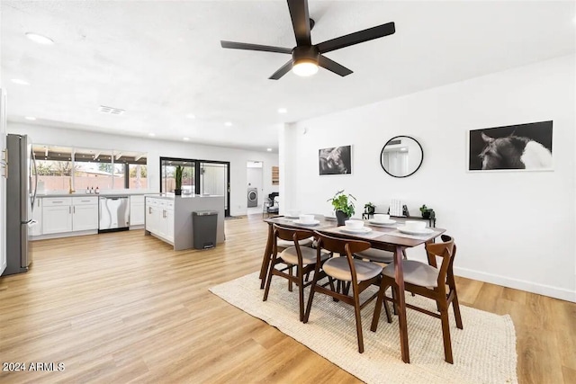 dining area featuring ceiling fan and light wood-type flooring