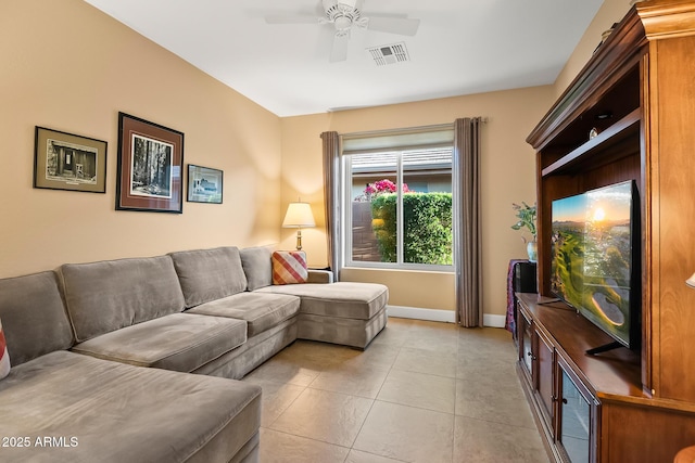 living room with ceiling fan, visible vents, baseboards, and light tile patterned flooring