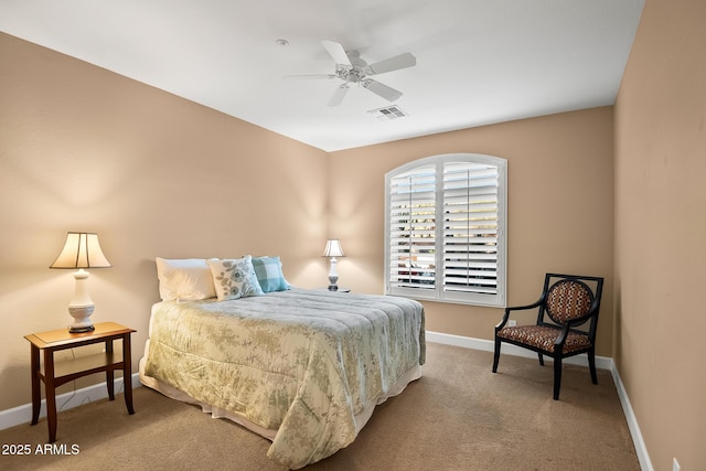 bedroom featuring carpet floors, baseboards, visible vents, and a ceiling fan