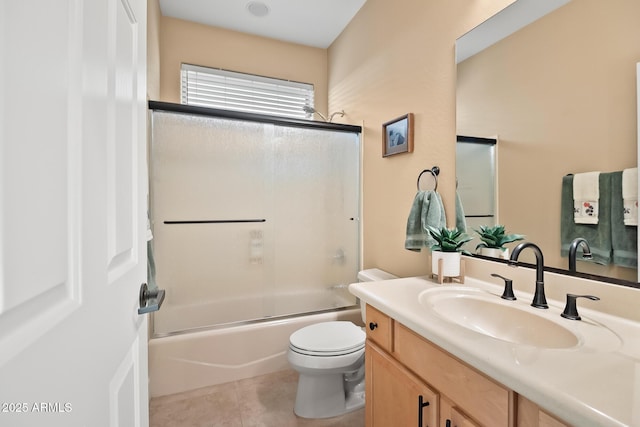 bathroom featuring toilet, tile patterned flooring, shower / bathing tub combination, and vanity