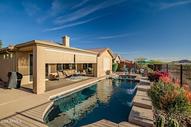 view of swimming pool featuring an outdoor hangout area, a patio area, a fenced backyard, and a fenced in pool