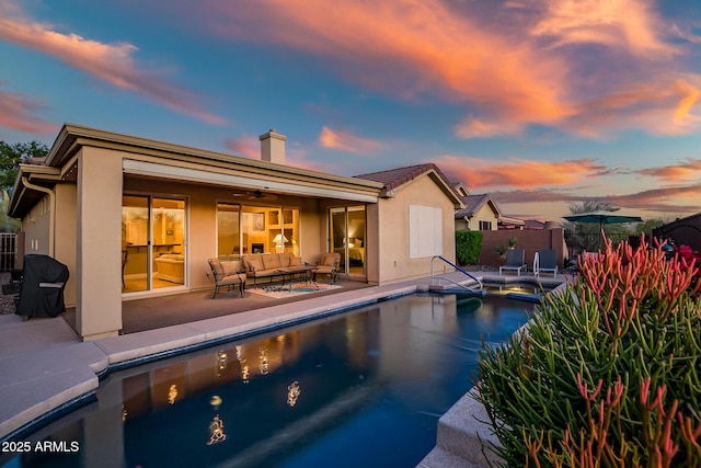 view of pool featuring a fenced in pool, ceiling fan, an outdoor hangout area, fence, and a patio area