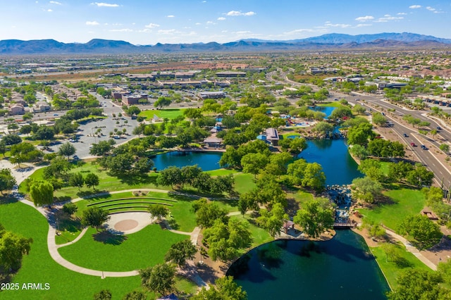 drone / aerial view with a water and mountain view