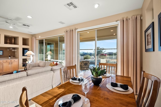 dining room with recessed lighting, visible vents, ceiling fan, and wood finished floors