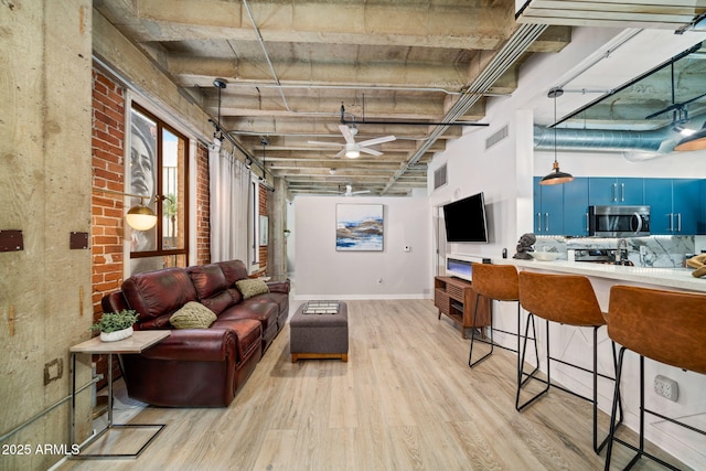 114 W Adams St Unit 202, Phoenix, AZ 85003 - living room featuring light wood-style flooring and ceiling fan
