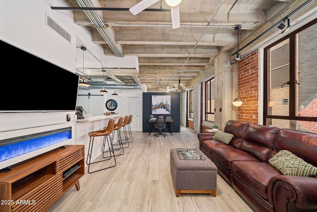 114 W Adams St Unit 202, Phoenix, AZ 85003 - living area featuring light wood-style flooring and ceiling fan