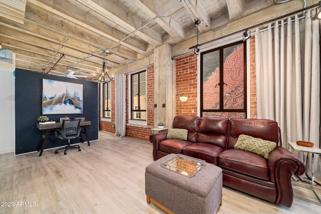 114 W Adams St Unit 202, Phoenix, AZ 85003 - living room with wood finished floors, brick wall, an office area, and beam ceiling
