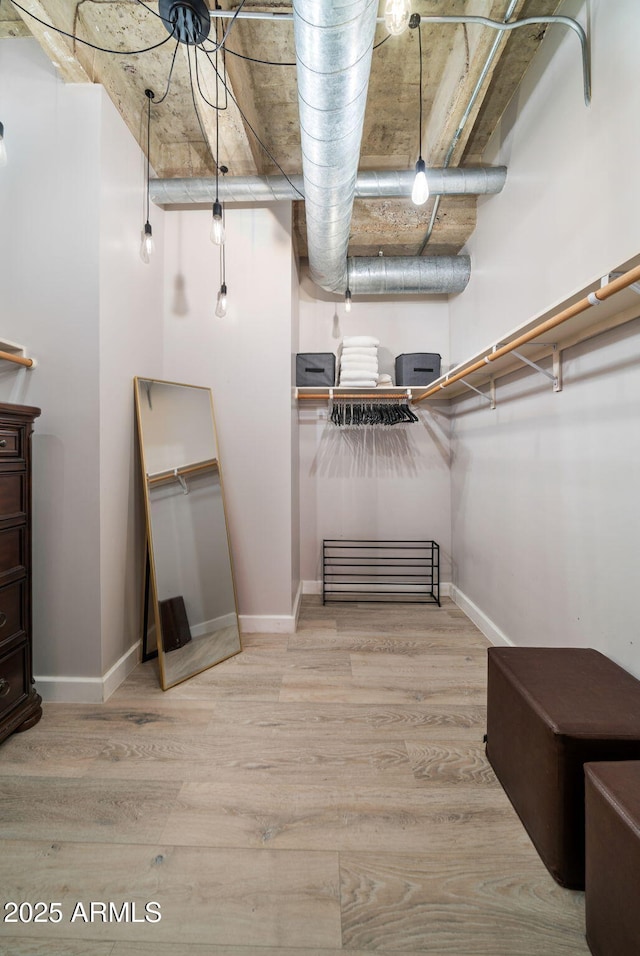 114 W Adams St Unit 202, Phoenix, AZ 85003 - walk in closet with wood finished floors