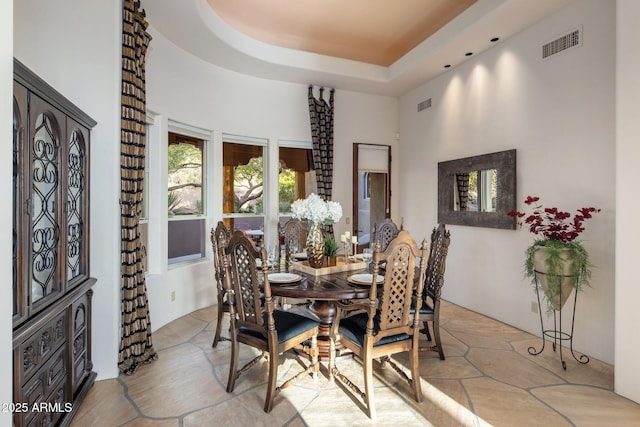 6001 E Restin Rd, Cave Creek, AZ 85331 - dining space featuring a towering ceiling, visible vents, and a tray ceiling