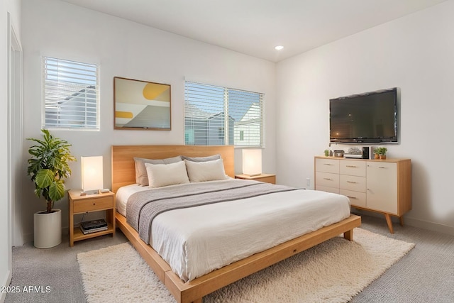 bedroom featuring light colored carpet