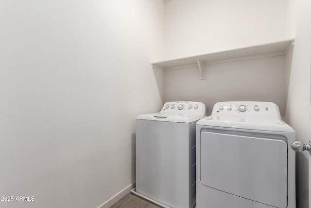 laundry room with washing machine and clothes dryer