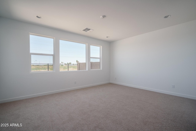 7956 W Griswold Rd, Peoria, AZ 85345 - carpeted spare room with baseboards and recessed lighting