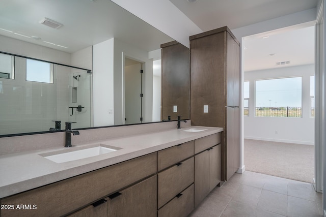7956 W Griswold Rd, Peoria, AZ 85345 - full bathroom with double vanity, tile patterned flooring, baseboards, and a shower