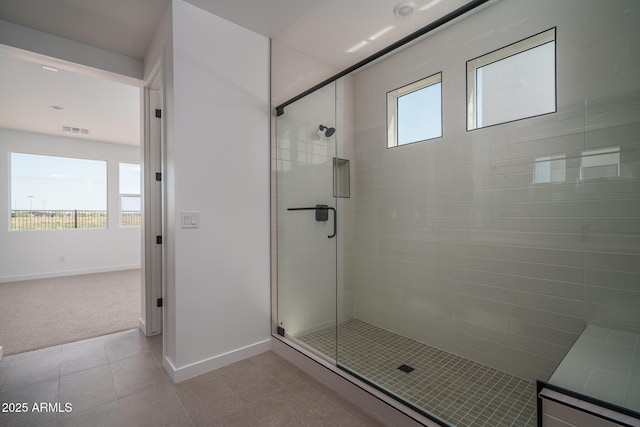 7956 W Griswold Rd, Peoria, AZ 85345 - full bath featuring baseboards, a shower stall, and tile patterned flooring