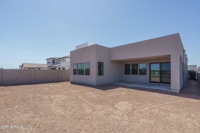 7956 W Griswold Rd, Peoria, AZ 85345 - back of house featuring a patio area and stucco siding