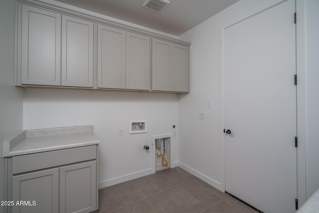 7956 W Griswold Rd, Peoria, AZ 85345 - laundry room with hookup for a gas dryer, hookup for an electric dryer, cabinet space, washer hookup, and baseboards