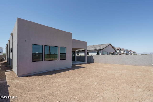 7956 W Griswold Rd, Peoria, AZ 85345 - rear view of property with a fenced backyard, cooling unit, and stucco siding