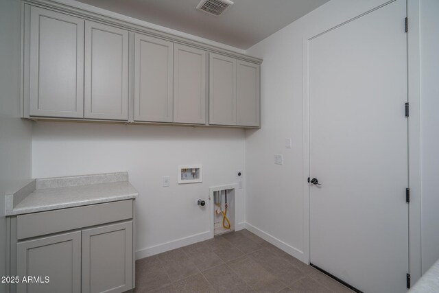 7956 W Griswold Rd, Peoria, AZ 85345 - laundry area featuring hookup for a gas dryer, electric dryer hookup, cabinet space, hookup for a washing machine, and baseboards