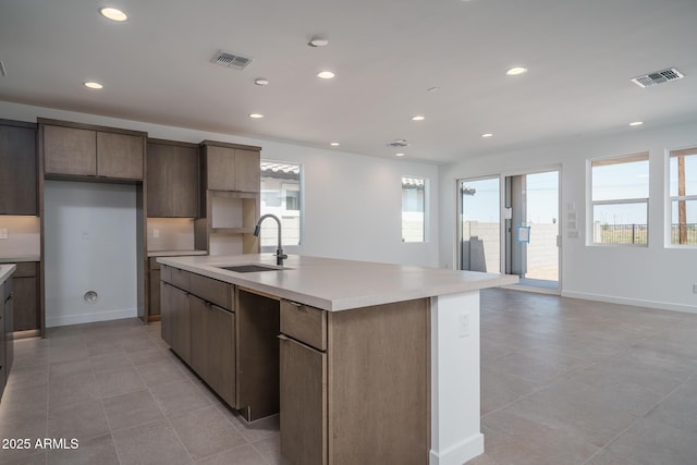 7956 W Griswold Rd, Peoria, AZ 85345 - kitchen featuring a sink, plenty of natural light, a center island with sink, light countertops, and recessed lighting