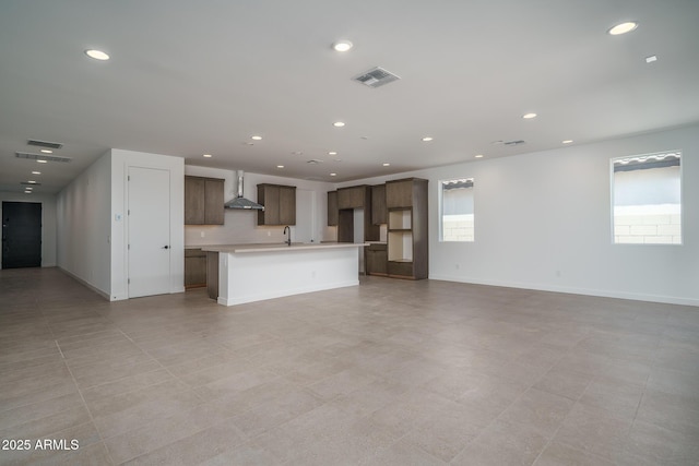 7956 W Griswold Rd, Peoria, AZ 85345 - unfurnished living room featuring healthy amount of natural light, a sink, recessed lighting, and baseboards