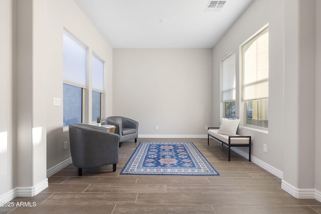 5245 N 205th Ln, Buckeye, AZ 85396 - sitting room with baseboards, visible vents, and wood finish floors