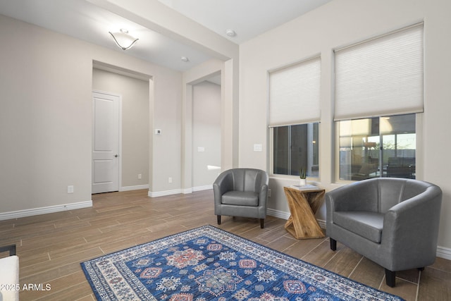 5245 N 205th Ln, Buckeye, AZ 85396 - sitting room with baseboards and wood tiled floor