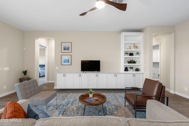 5245 N 205th Ln, Buckeye, AZ 85396 - living area featuring dark wood finished floors, baseboards, and ceiling fan