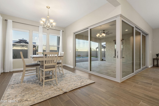 5245 N 205th Ln, Buckeye, AZ 85396 - dining space featuring baseboards, wood finished floors, and an inviting chandelier