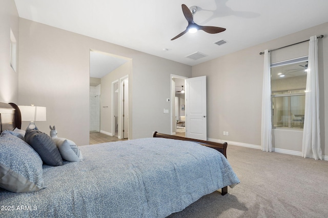 5245 N 205th Ln, Buckeye, AZ 85396 - bedroom featuring baseboards, visible vents, and light colored carpet