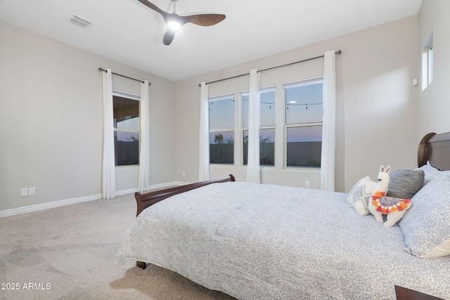 5245 N 205th Ln, Buckeye, AZ 85396 - carpeted bedroom featuring baseboards, ceiling fan, and visible vents