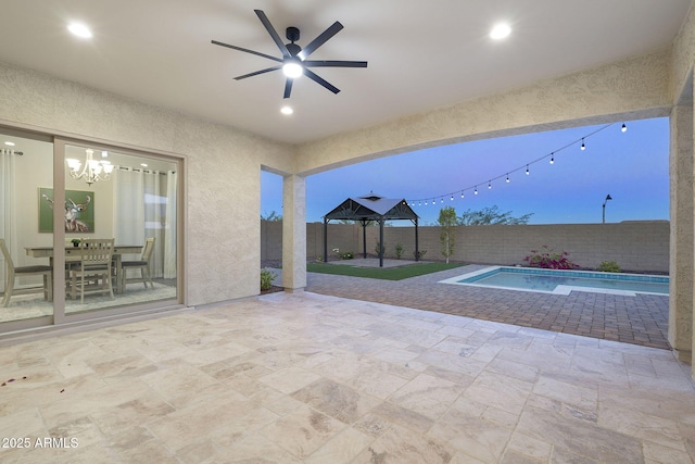 5245 N 205th Ln, Buckeye, AZ 85396 - view of patio with a fenced backyard, ceiling fan, and a fenced in pool