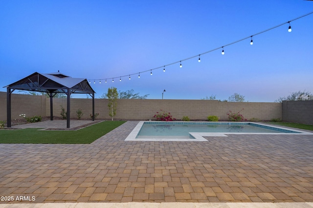 5245 N 205th Ln, Buckeye, AZ 85396 - view of pool featuring a fenced backyard, a fenced in pool, and a patio