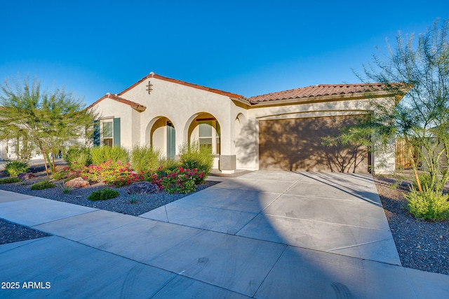 5245 N 205th Ln, Buckeye, AZ 85396 - mediterranean / spanish-style house featuring driveway, a garage, a tiled roof, and stucco siding
