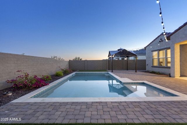 5245 N 205th Ln, Buckeye, AZ 85396 - view of swimming pool with a patio, a fenced in pool, and a fenced backyard