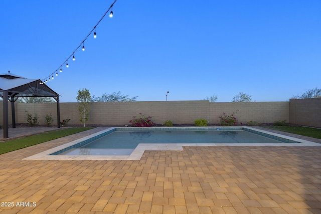 5245 N 205th Ln, Buckeye, AZ 85396 - view of swimming pool featuring a fenced backyard, a patio area, and a fenced in pool