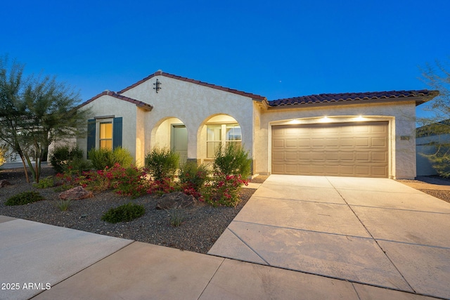 5245 N 205th Ln, Buckeye, AZ 85396 - mediterranean / spanish home with stucco siding, a tile roof, and concrete driveway