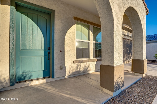 5245 N 205th Ln, Buckeye, AZ 85396 - property entrance with stucco siding and a patio