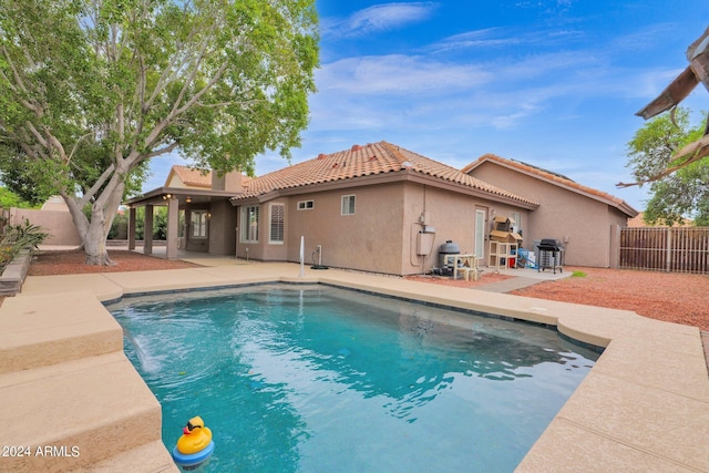 view of pool featuring a patio area, a fenced in pool, and a fenced backyard