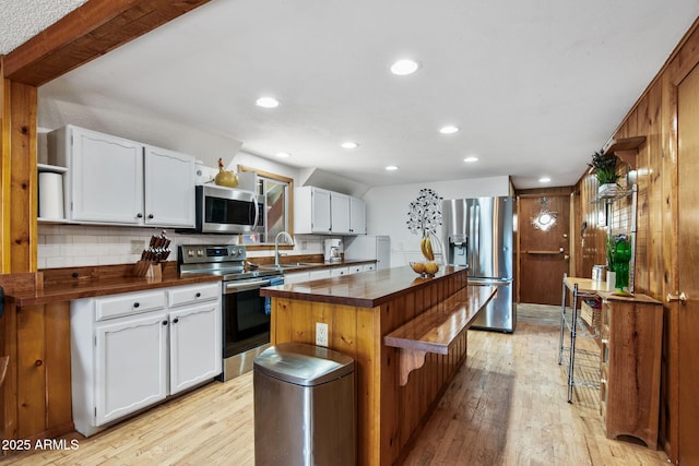 3219 N Pinewood Dr, Pine, AZ 85544 - kitchen with stainless steel appliances, a sink, light wood finished floors, butcher block countertops, and recessed lighting