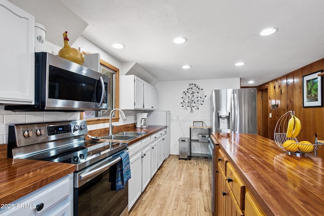 3219 N Pinewood Dr, Pine, AZ 85544 - kitchen with wooden counters, appliances with stainless steel finishes, a sink, decorative backsplash, and recessed lighting