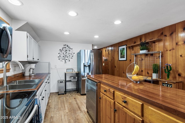 3219 N Pinewood Dr, Pine, AZ 85544 - kitchen with wooden counters, stainless steel appliances, a sink, light wood-type flooring, and recessed lighting